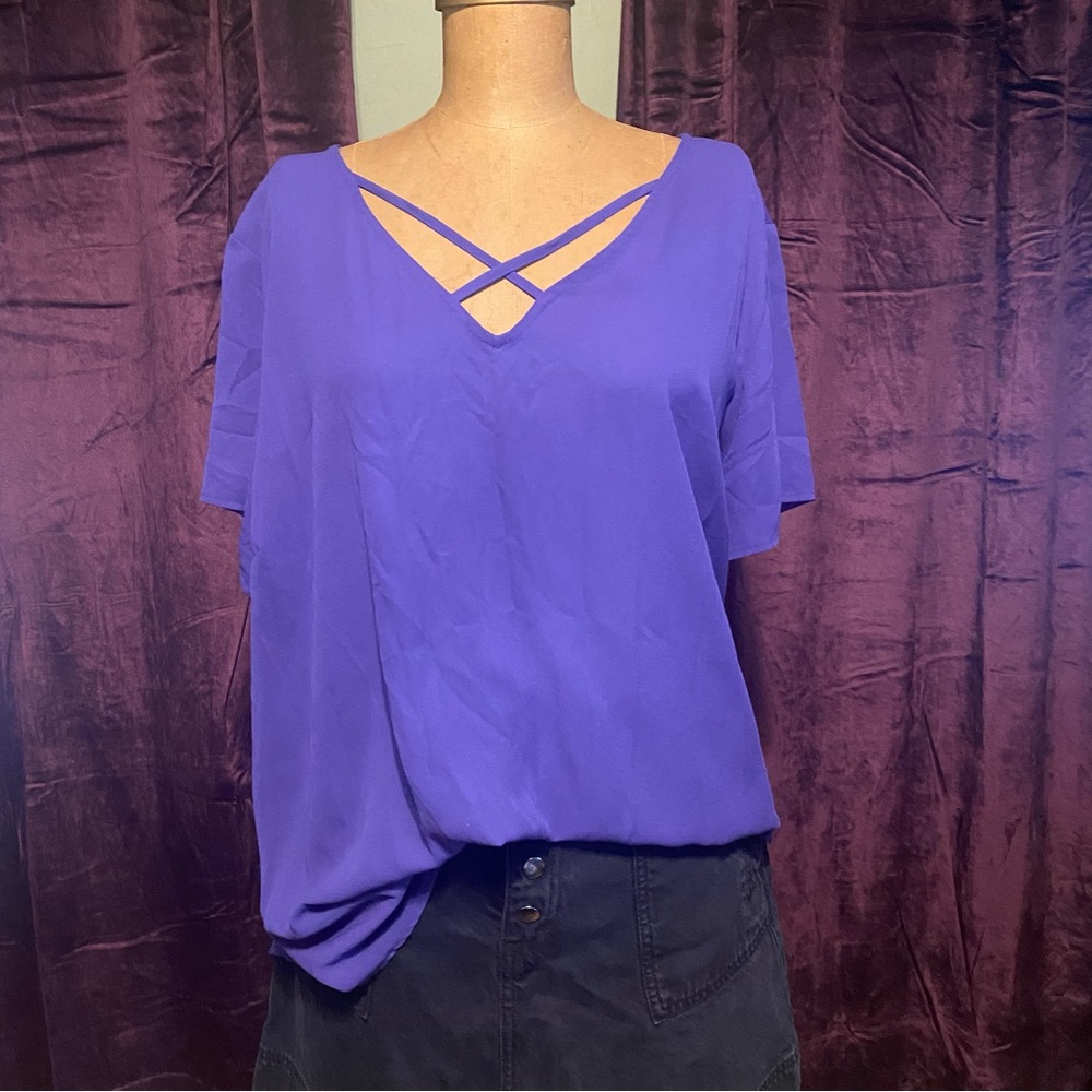 Purple short sleeve shirt with cross cross detailing